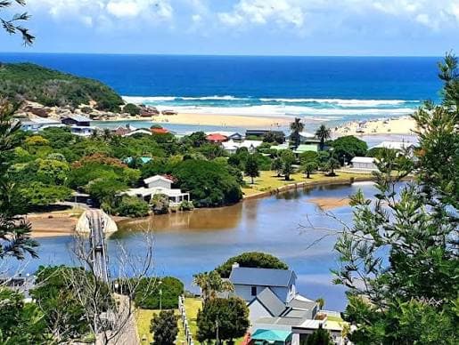 Groot Brak River winding past homes to the lagoon mouth and beach